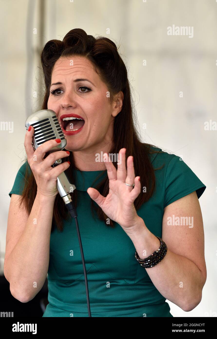 Singer Stephanie Belle performing during a 50s Weekend at Ropley station on the Watercress Line, Ropley, Hampshire, UK. Stock Photo