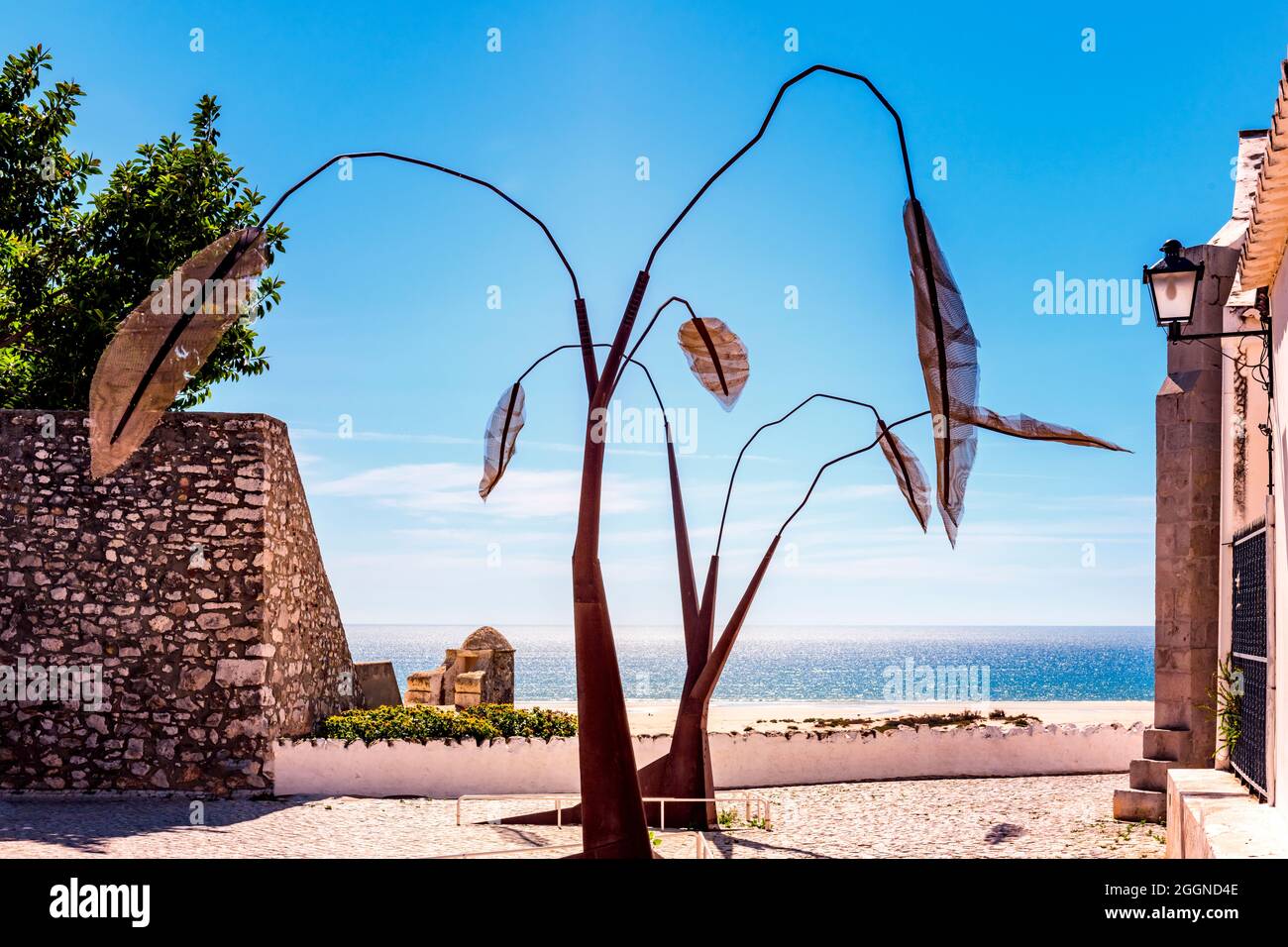 Iron metal tree sculpture sculptures near the sea front seafront Cacela Velha Algarve Portugal Stock Photo