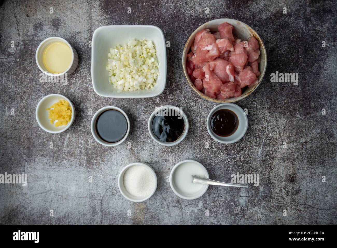 Siopao Asado pork filling ingredients for Filipino steamed bun against a concrete background Stock Photo