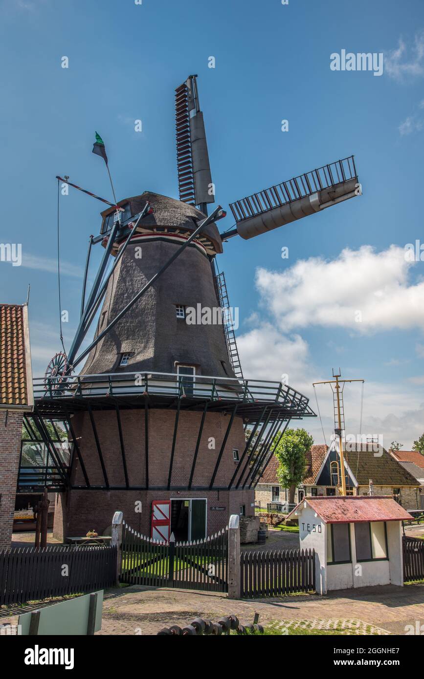 Oudeschild, the Netherlands. August 13 2021. De molen in het dorpje Oudeschild op het eiland Texel. High quality photo Stock Photo