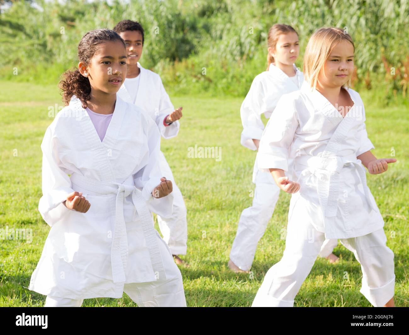 Group of children exercising in karate and traditional martial arts
