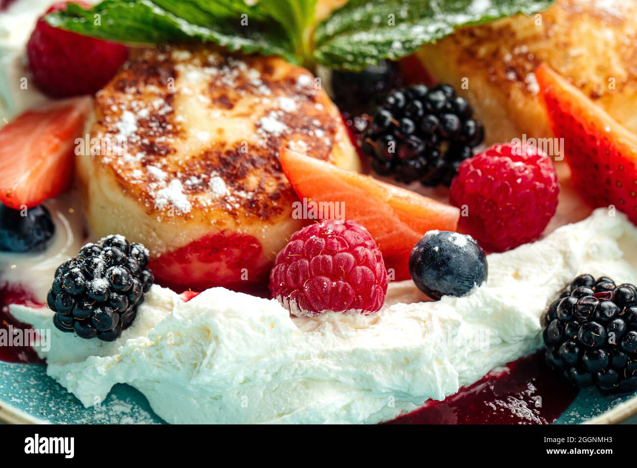 Closeup on cottage cheese pancakes with berries Stock Photo