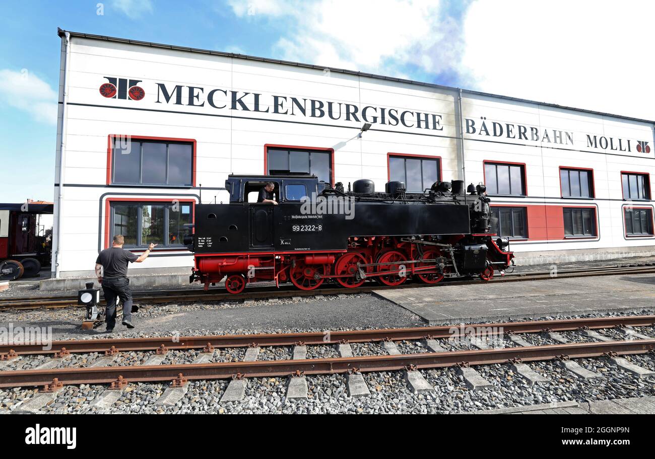 Bad Doberan, Germany. 02nd Sep, 2021. A locomotive of the Molli narrow-gauge railway shunts in front of the workshop building. The Mecklenburg Bäderbahn Molli MBB receives a funding decision for 662,000 euros for the renewal of rails, points and signalling technology. This means that the state will cover 75 percent of the costs incurred for the project. Credit: Bernd Wüstneck/dpa-Zentralbild/dpa/Alamy Live News Stock Photo