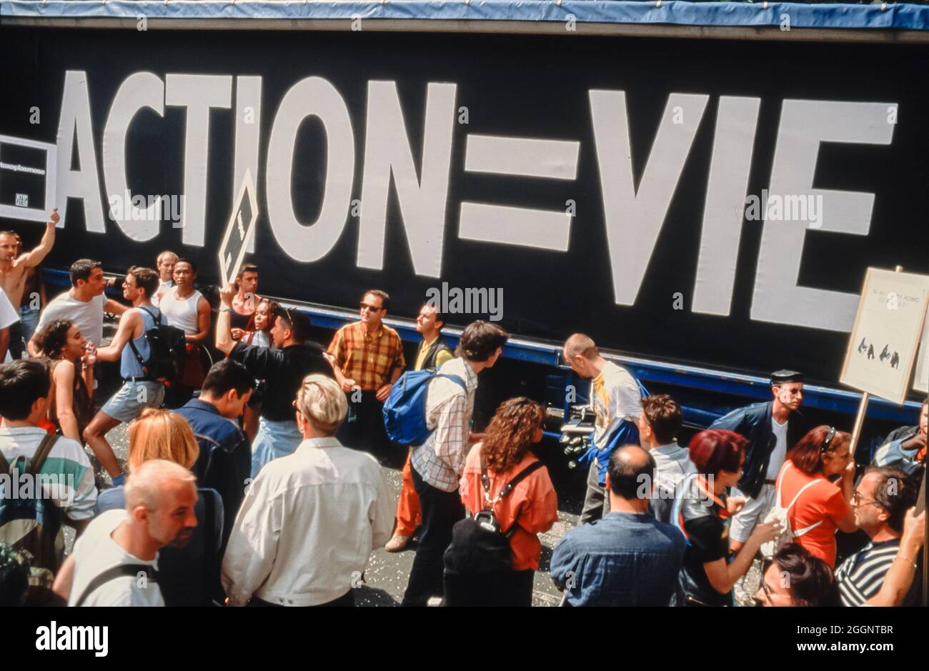 Crowd of People, Crowd AIDS Activists of Act Up PAris Demonstrating on Street, 'Gay Pride' 1996, Queer activism, pride march, Protest Banner 'Action = Life' Slogan Stock Photo
