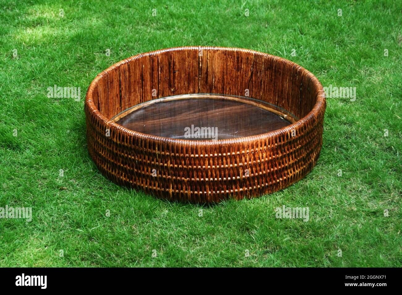 cane gift basket in brown color with green background, cane gift basket