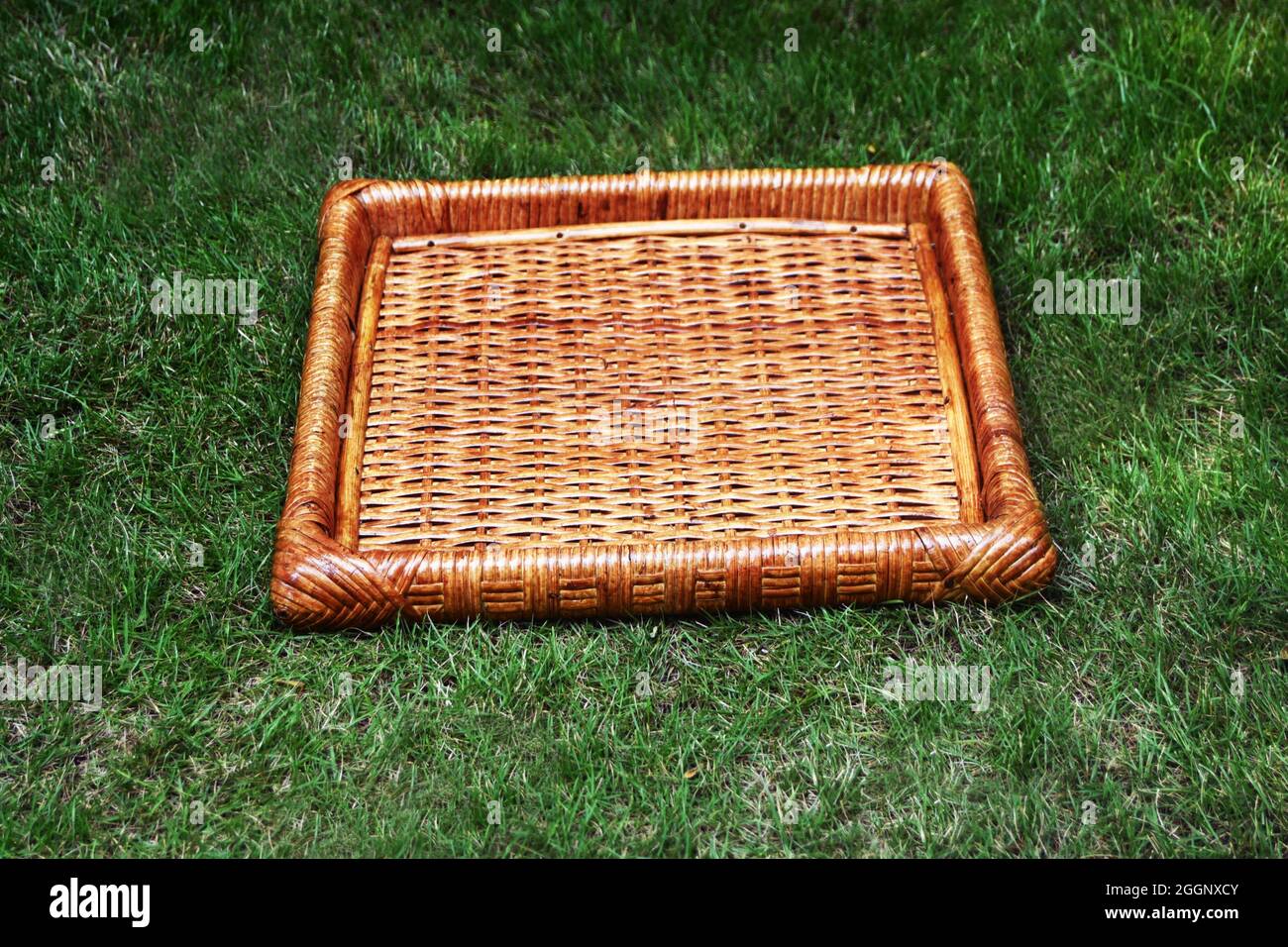 Rattan cane tray dark brown color with outdoor background selective