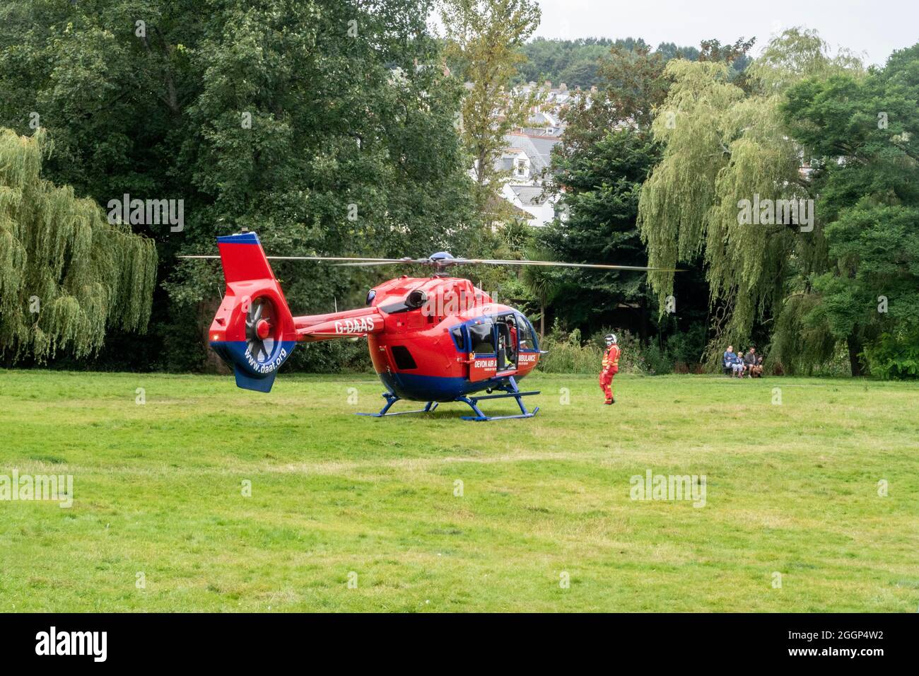 Devon Air Ambulance responding to an emergency call, and landing in The Byes, Sidmouth Stock Photo