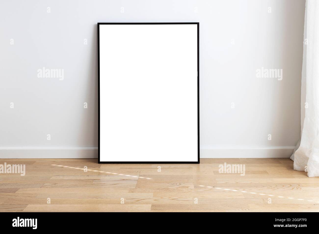 Rectangular mock up standing in a room with wooden flooring. Stock Photo