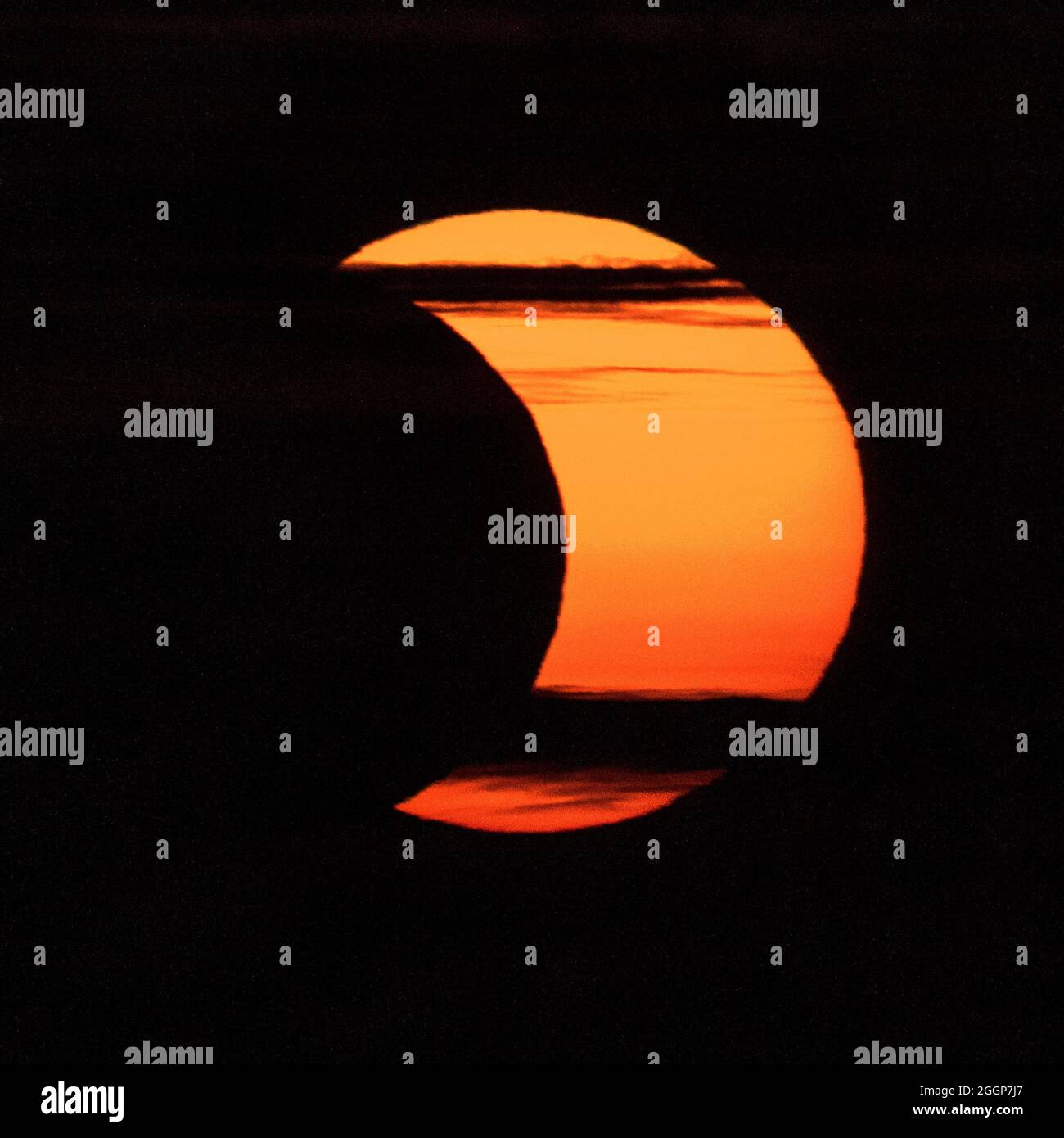 A partial 'ring of fire' solar eclipse is seen from Arlington, Virginia on Thursday, June 10, 2021. Stock Photo