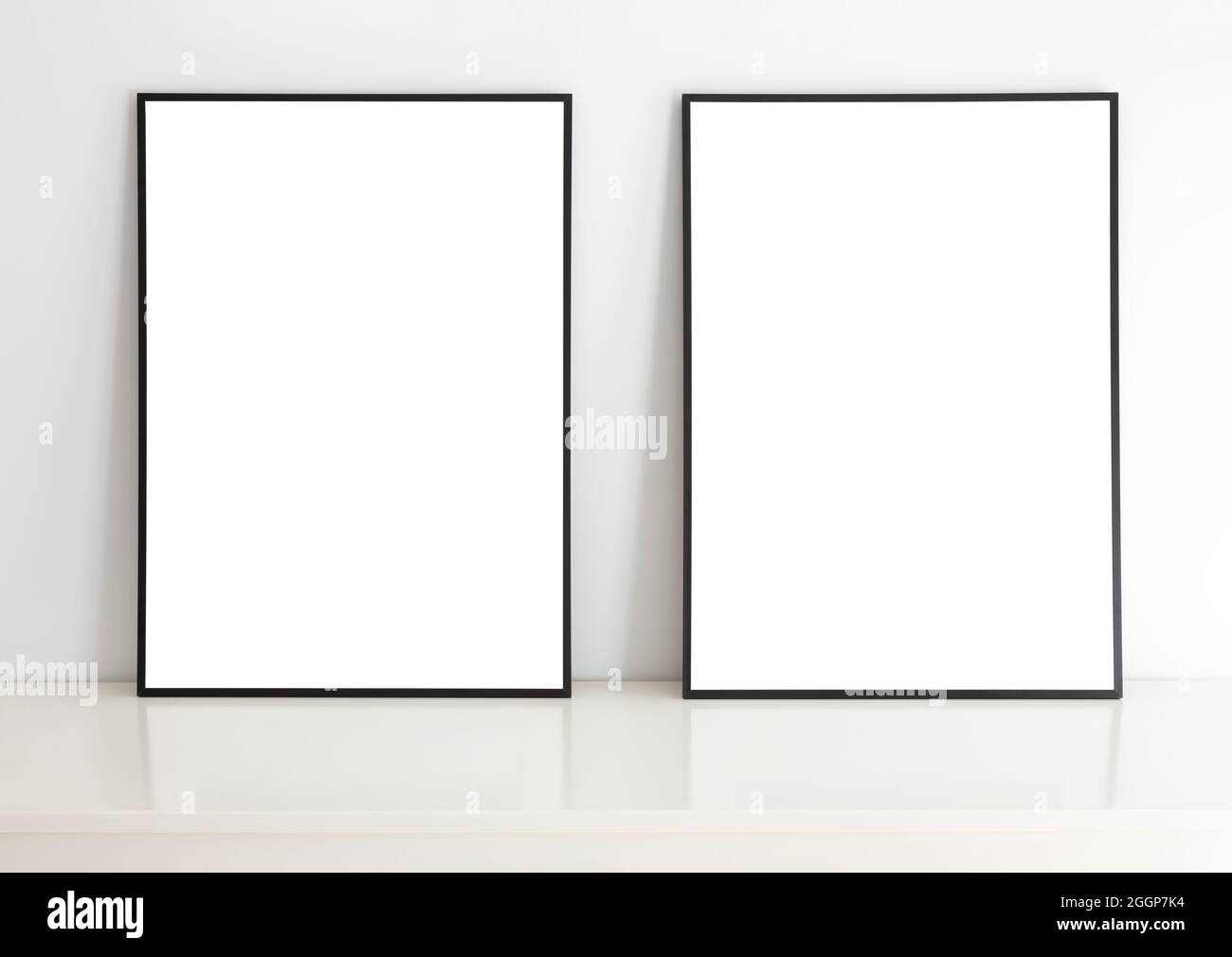 Empty frames for mock up, with white passepartout, standing portait mode. Stock Photo