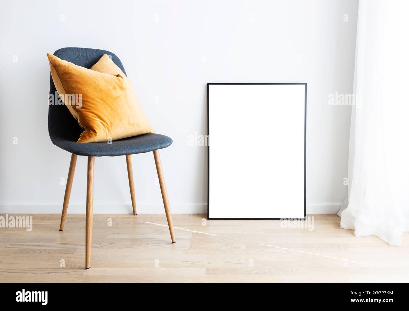 Modern interior with mockup frame and chair. Stock Photo