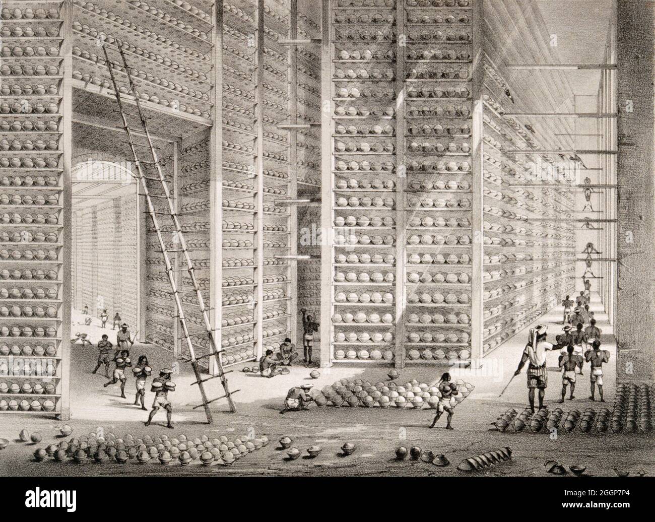 A busy stacking room in the opium factory at Patna, India. Stock Photo