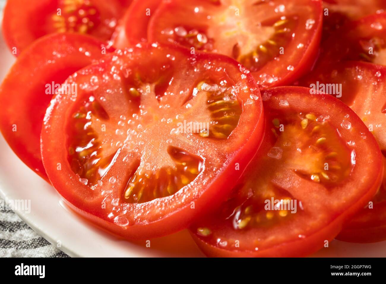 Healthy Organic Sliced Tomatoes with Salt Ready to Eat Stock Photo