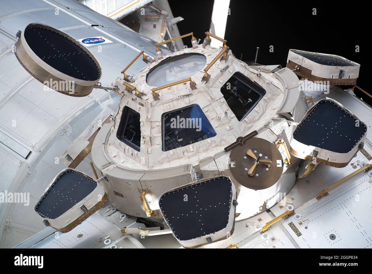 The International Space Station's seven-windowed cupola, seen from a window on Russia's newest addition to the orbiting lab, the Nauka Multipurpose Laboratory Module. Stock Photo