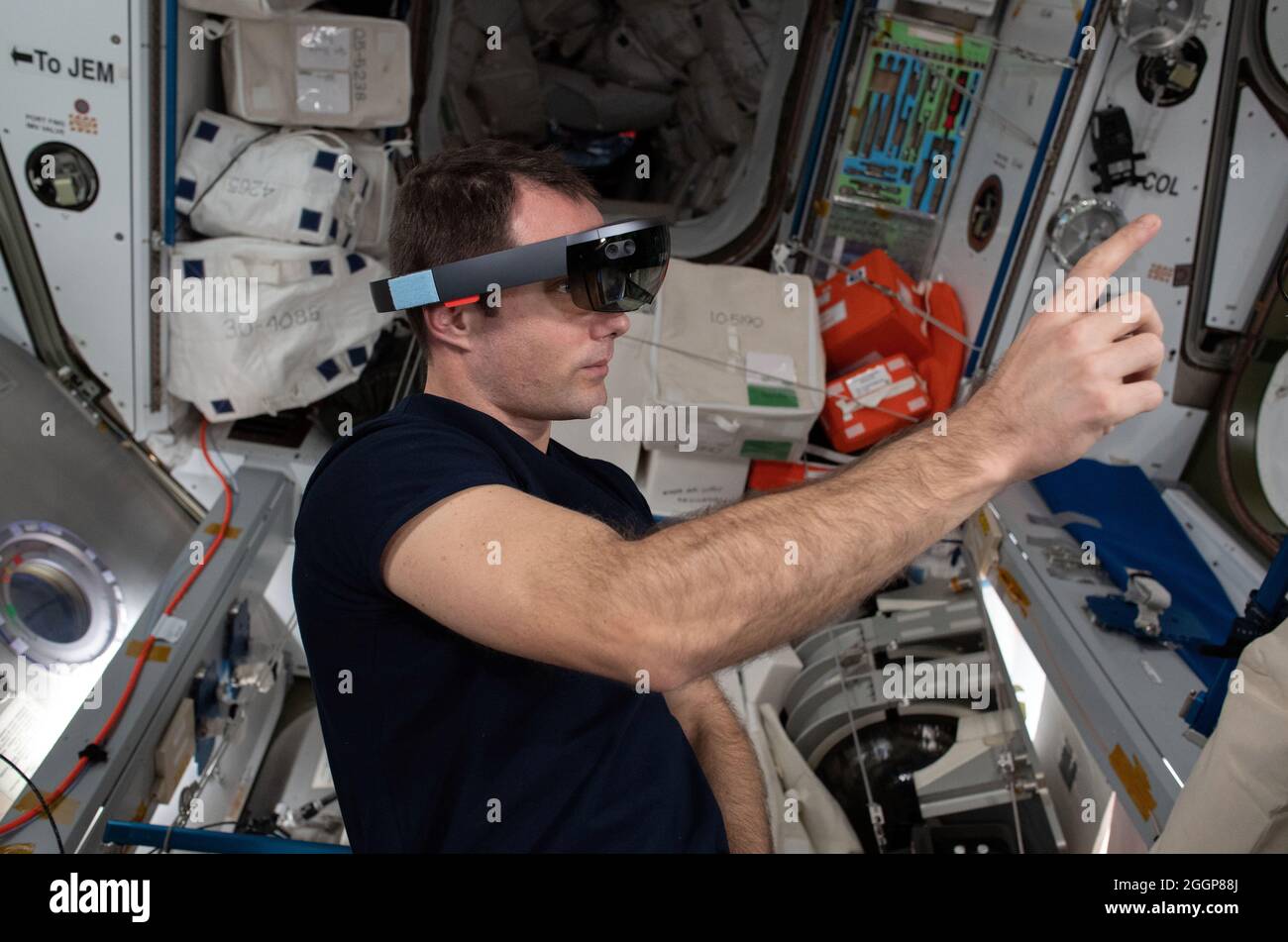 Expedition 65 Flight Engineer Thomas Pesquet of ESA (European Space Agency) wears Sidekick goggles to demonstrate using augmented reality while interacting with components aboard the International Space Station. Stock Photo