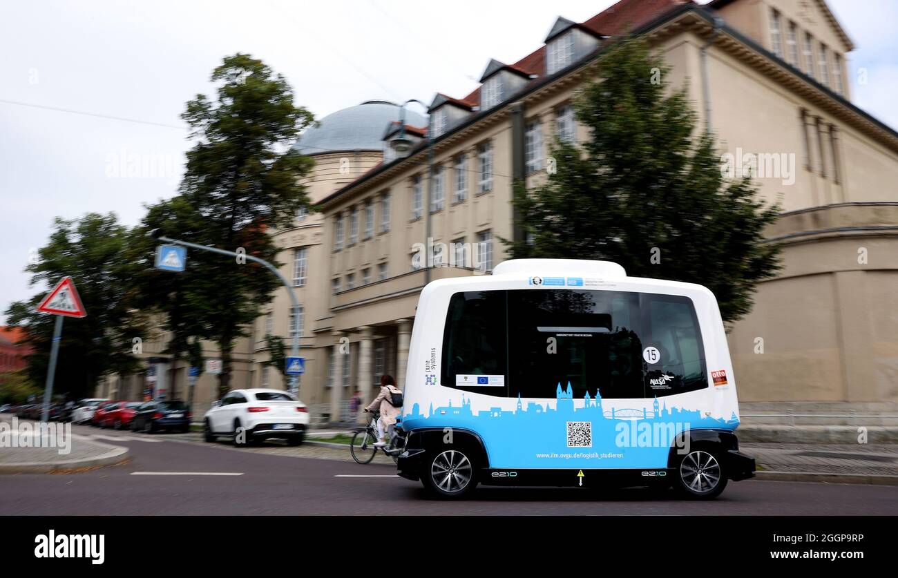 Magdeburg, Germany. 02nd Sep, 2021. The French minibus EZ10, an autonomously driving shuttle bus, drives through the old town of Magdeburg. At up to 15 kilometers per hour, the intelligent electric shuttle 'Elbi' will be driving through Magdeburg starting Friday. By the end of the year, the minibus with six seats will commute on a pre-programmed route between Seumstraße in the old town and the city park. Credit: Ronny Hartmann/dpa/Alamy Live News Stock Photo