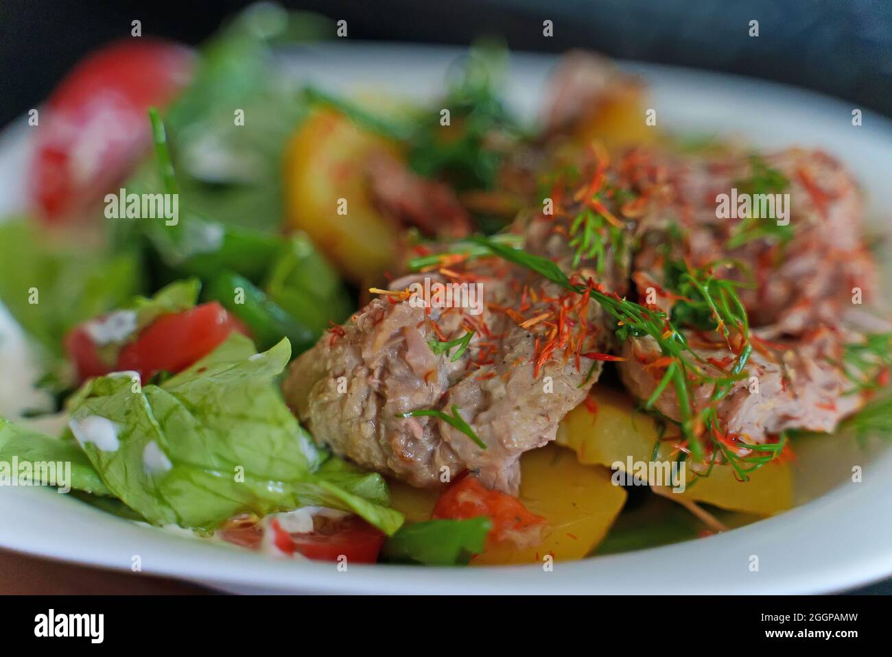 Pulled pork with potatoes and herbs Stock Photo Alamy