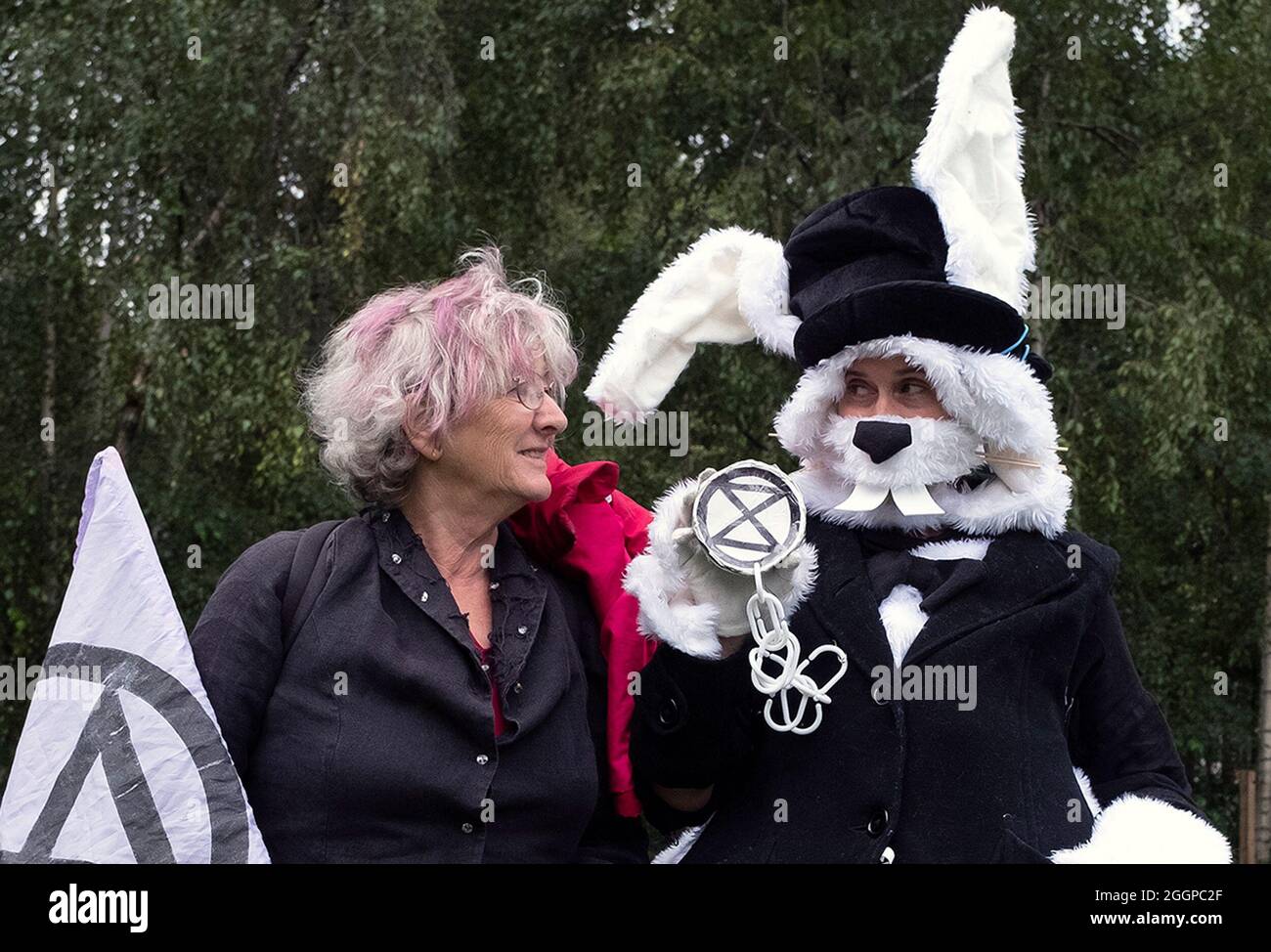 Two protestors, one dressed as a rabbit, pictured as protestors gather outside of Tate Modern ahead of Extinction Rebellion's Mass Bail Break protest on the eleventh day of their Impossible Rebellion protests in London, United Kingdom on September 2, 2021. Stock Photo