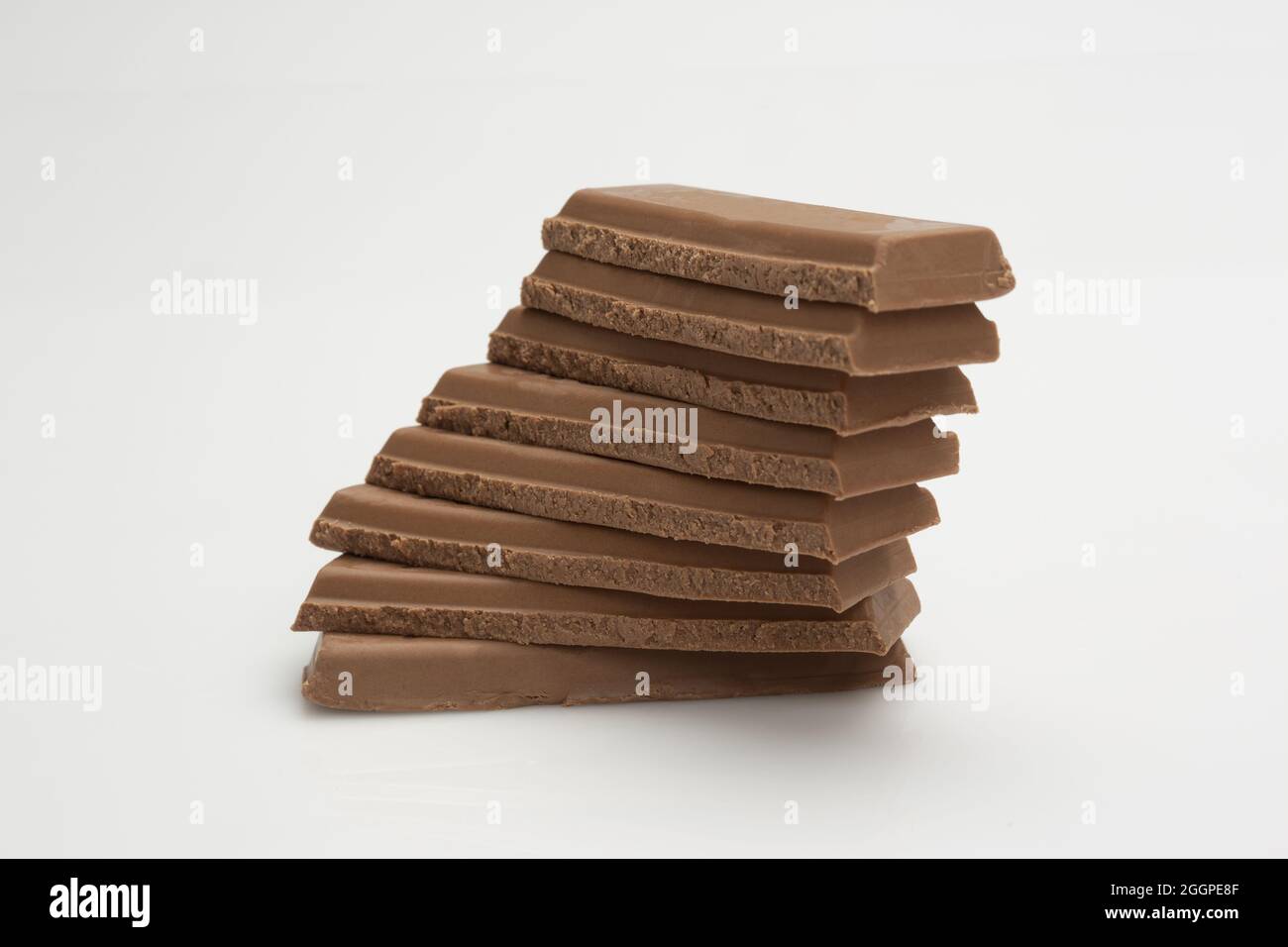 Wooden objects stacked on each other on the white surface Stock Photo