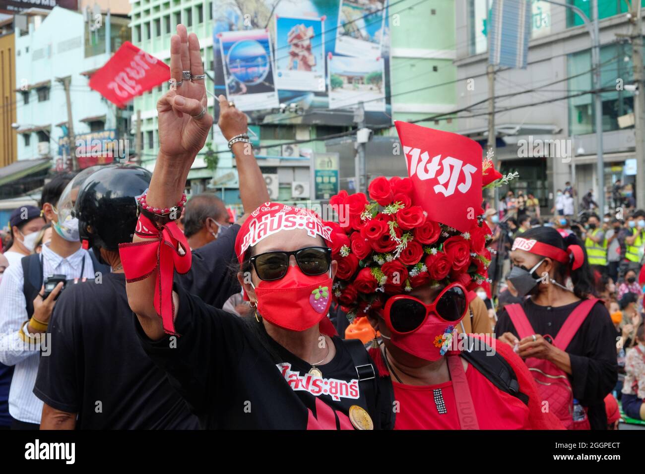 Bangkok, Thailand, 2 September 2021, two women in red protest for the resignation of Prime Minister General Prayut Chan-ocha. The protest is part of an ongoing series across Bangkok to voice disaffection with the current government's performance during the COVID pandemic. Credit: James Patrick/Alamy Live News Stock Photo