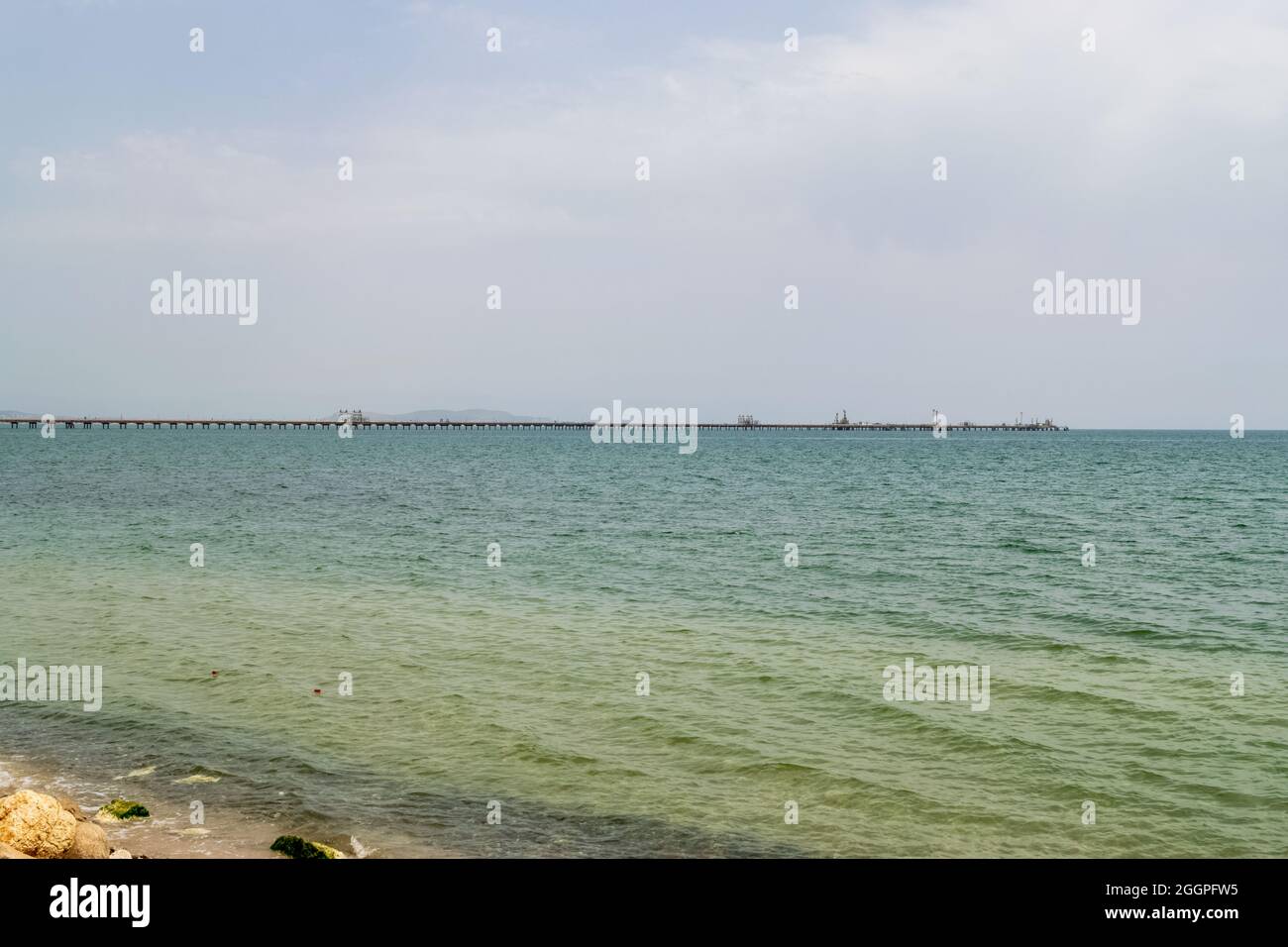 View of an oil pipeline and a dock for oil tankers. Stock Photo
