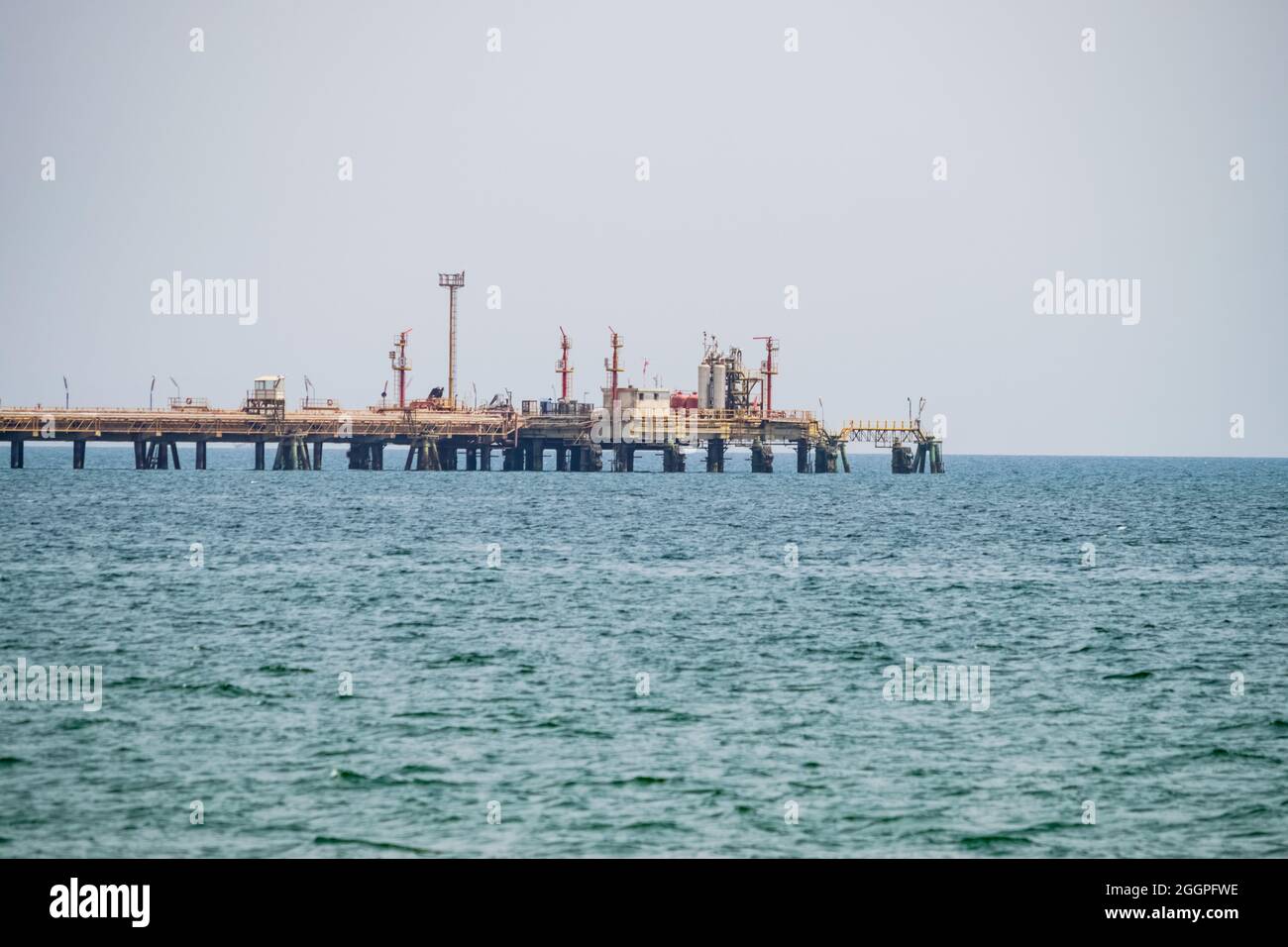 View of an oil pipeline and a dock for oil tankers. Stock Photo