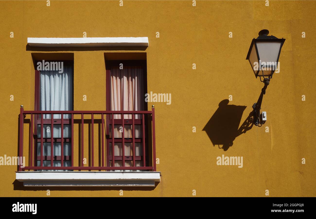 old street lamp on the wall, next to a picturesque balcony, Santa Brigita, Gran Canaria, Canary islands Stock Photo