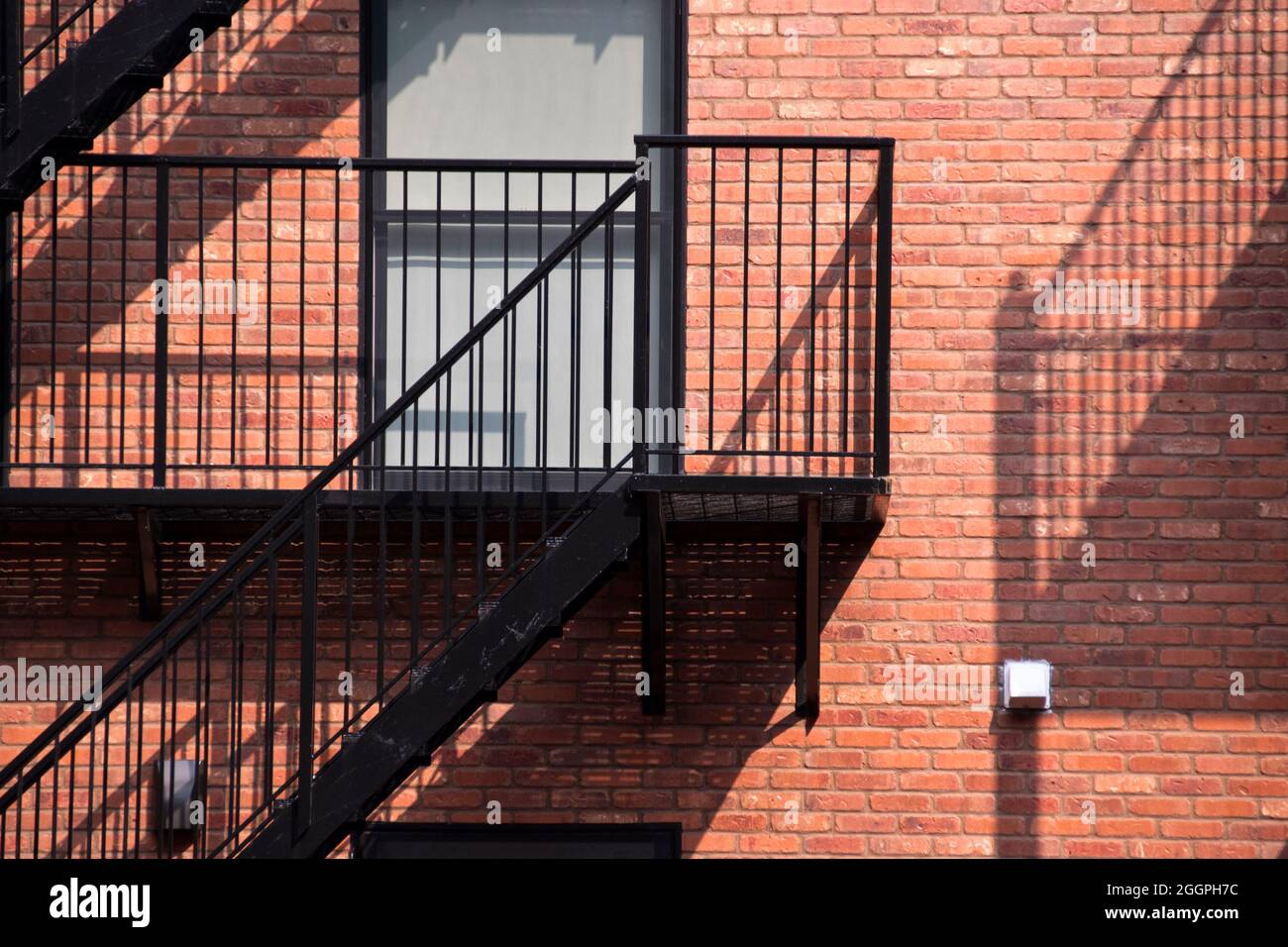 Steel fire escapes on the exterior of a brick apartment building in Hoboken, New Jersey, USA. Stock Photo