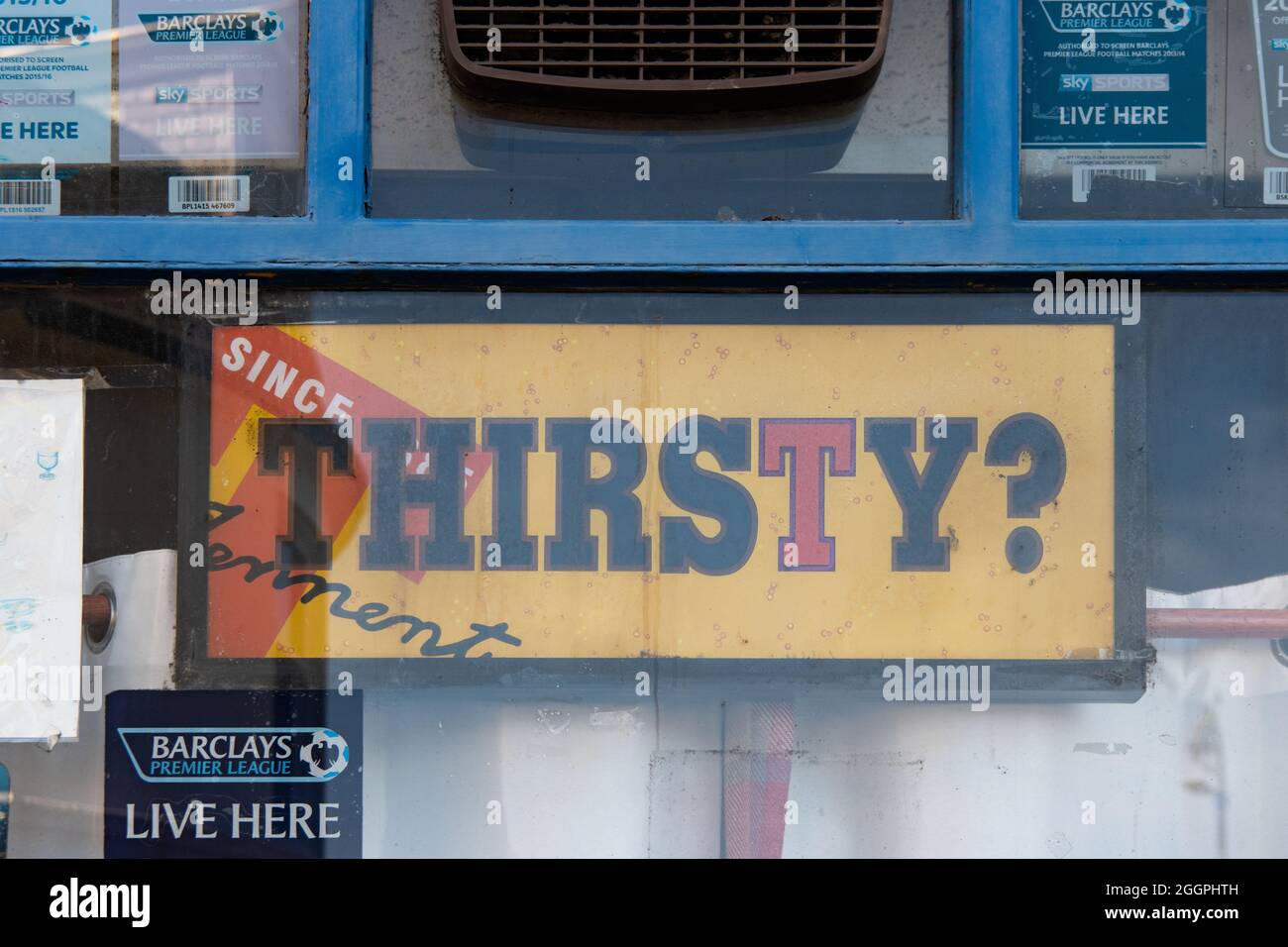 Tennents advertising sign 'thirsty' in pub window, Scotland, UK Stock Photo