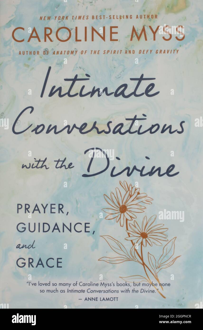 The book, Intimate Conversations with the Divine by Caroline Myss Stock Photo