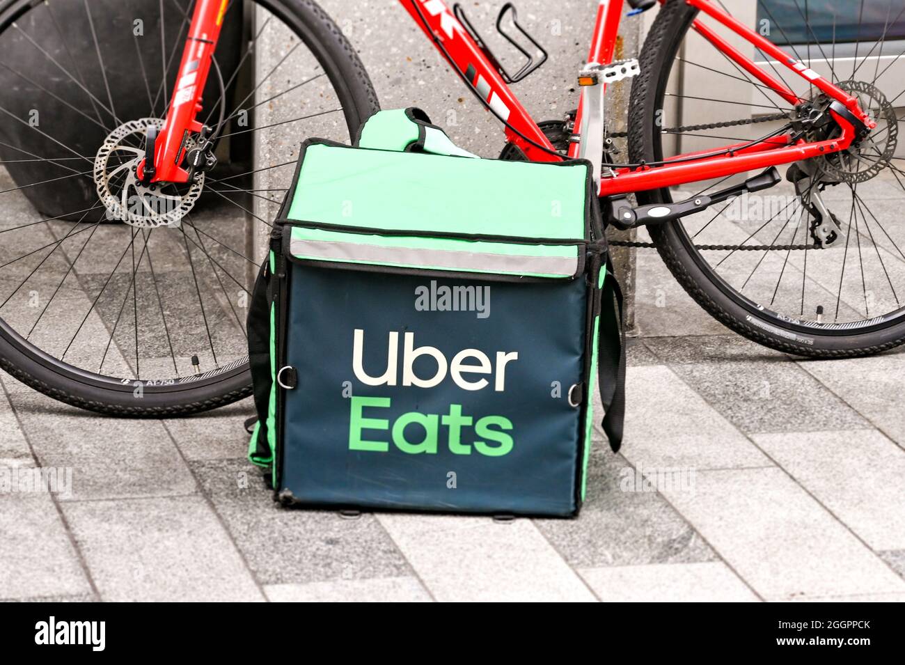 London England August 2021 Insulated container for Uber Eats delivery service on the floor next to a bicycle. No people Stock Photo Alamy