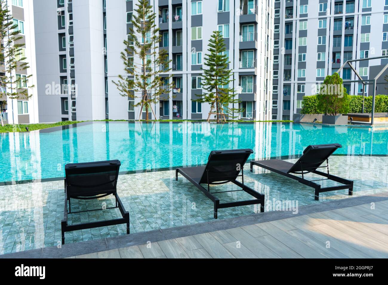 Recreation area with swimming pool in a modern condominium residential ...