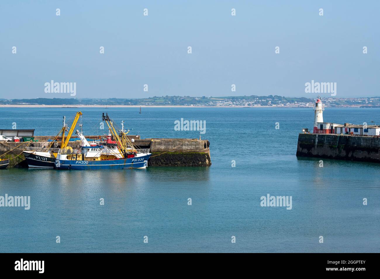 Newlyn, Cornwall, England, UK. 2021. Fishing trawlers alongside the