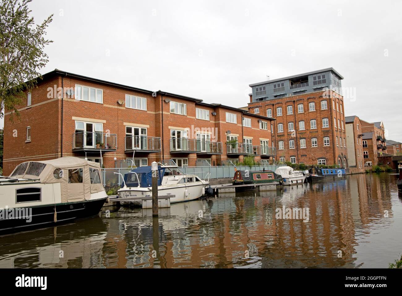 Apartments with boats moored in Worcester and Birmingham canal Diglis