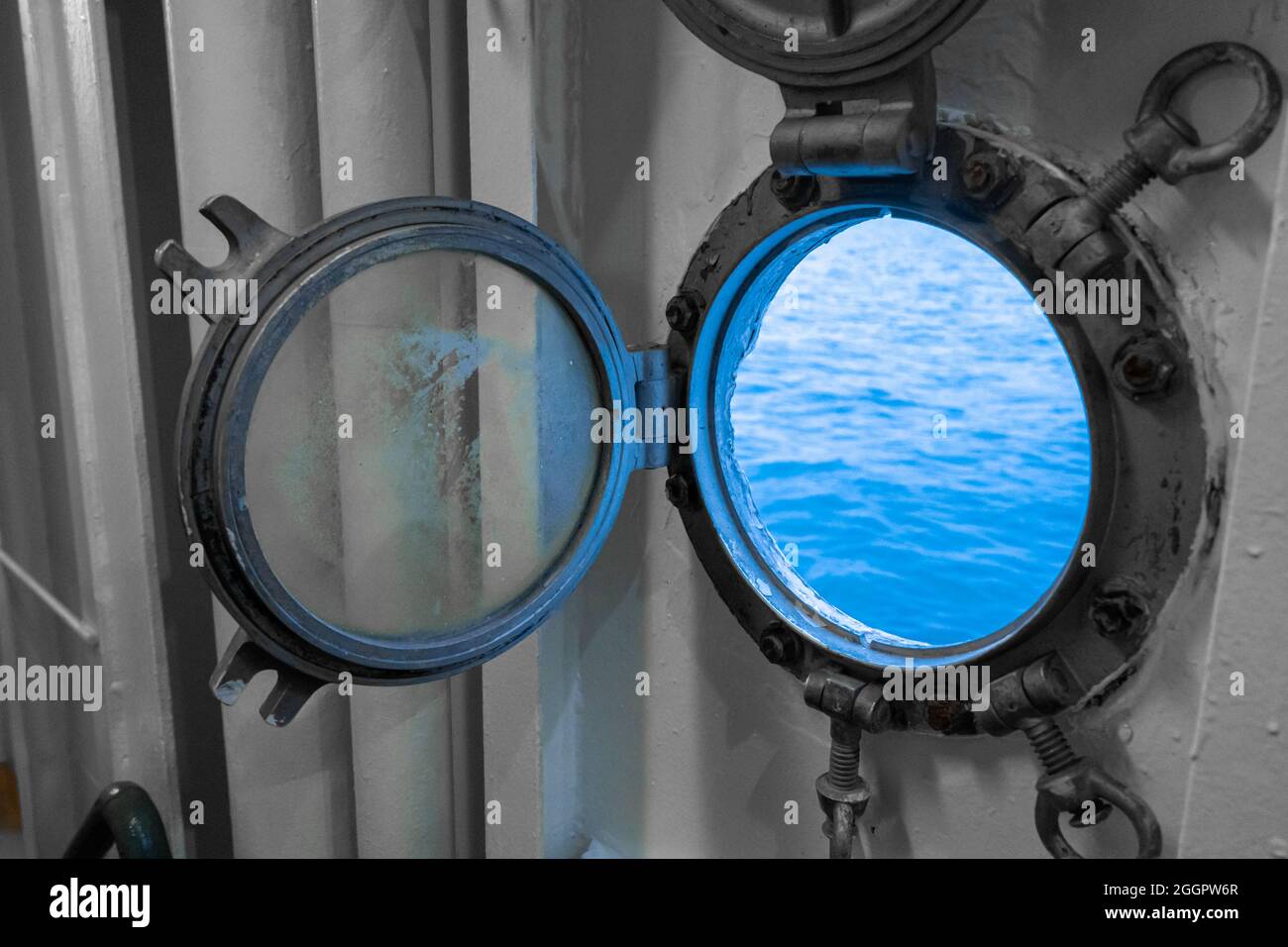 Porthole in the ferry cabin. The ferry sails on the sea Stock Photo Alamy