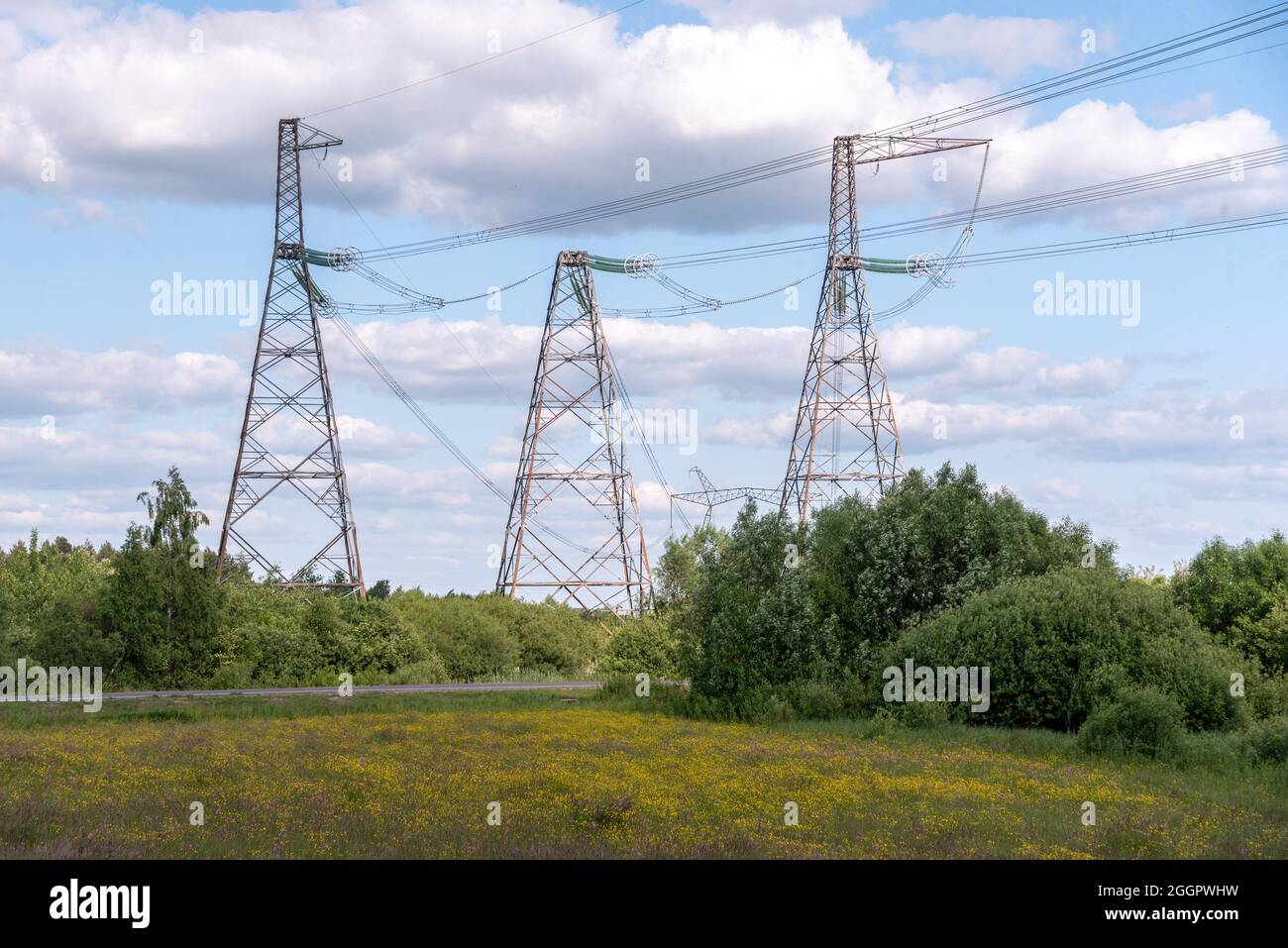 A view of power lines, electric power transmissions in a field in western Ukraine.Prime Minister of Ukraine, Denis Shmygal announced that from October 1st, the cost of electricity for 80% of the population will decrease following the Cabinet of Ministers passing a resolution which reduced the electricity tariff to UAH 1.44 per kilowatt/hour if households consume less than 250 kilowatt/hours per month. At the same time, if the household uses more than this norm, then all consumed electricity must be paid at full price - UAH 1.68 per kWh. (Photo by Mykola Tys/SOPA Images/Sipa USA) Stock Photo