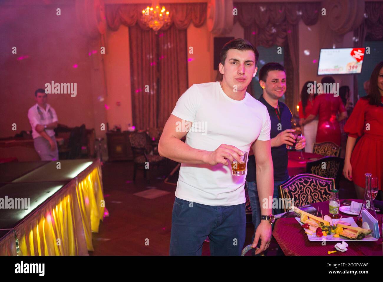 Odessa, Ukraine April 26, 2014: Ministerium night club. People smiling and posing on cam during concert in night club party. Man and woman have fun at Stock Photo