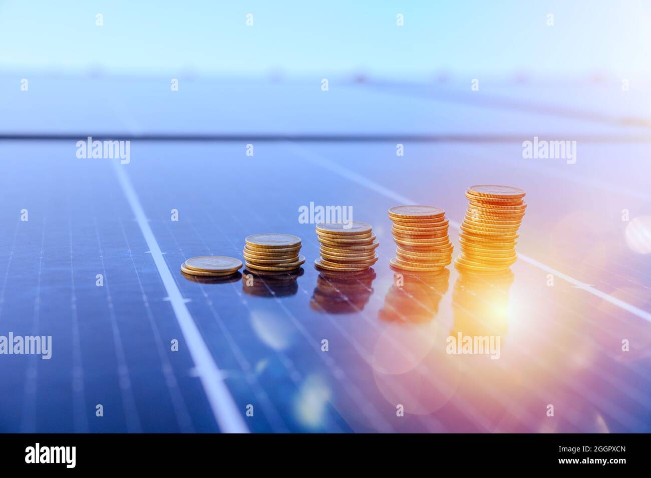 Money saved by using energy with solar panel Stock Photo Alamy