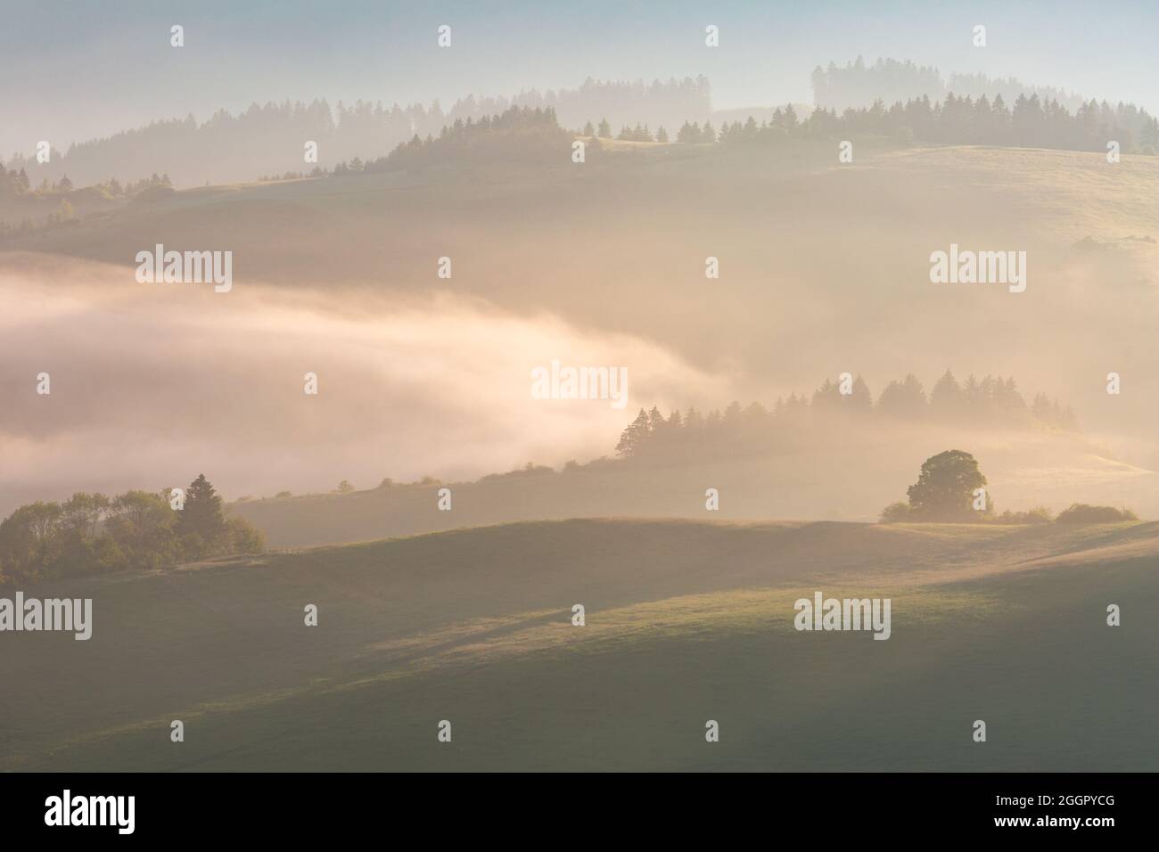 Foggy rural landscape at Turcianske Jaseno village, Slovakia. Stock Photo