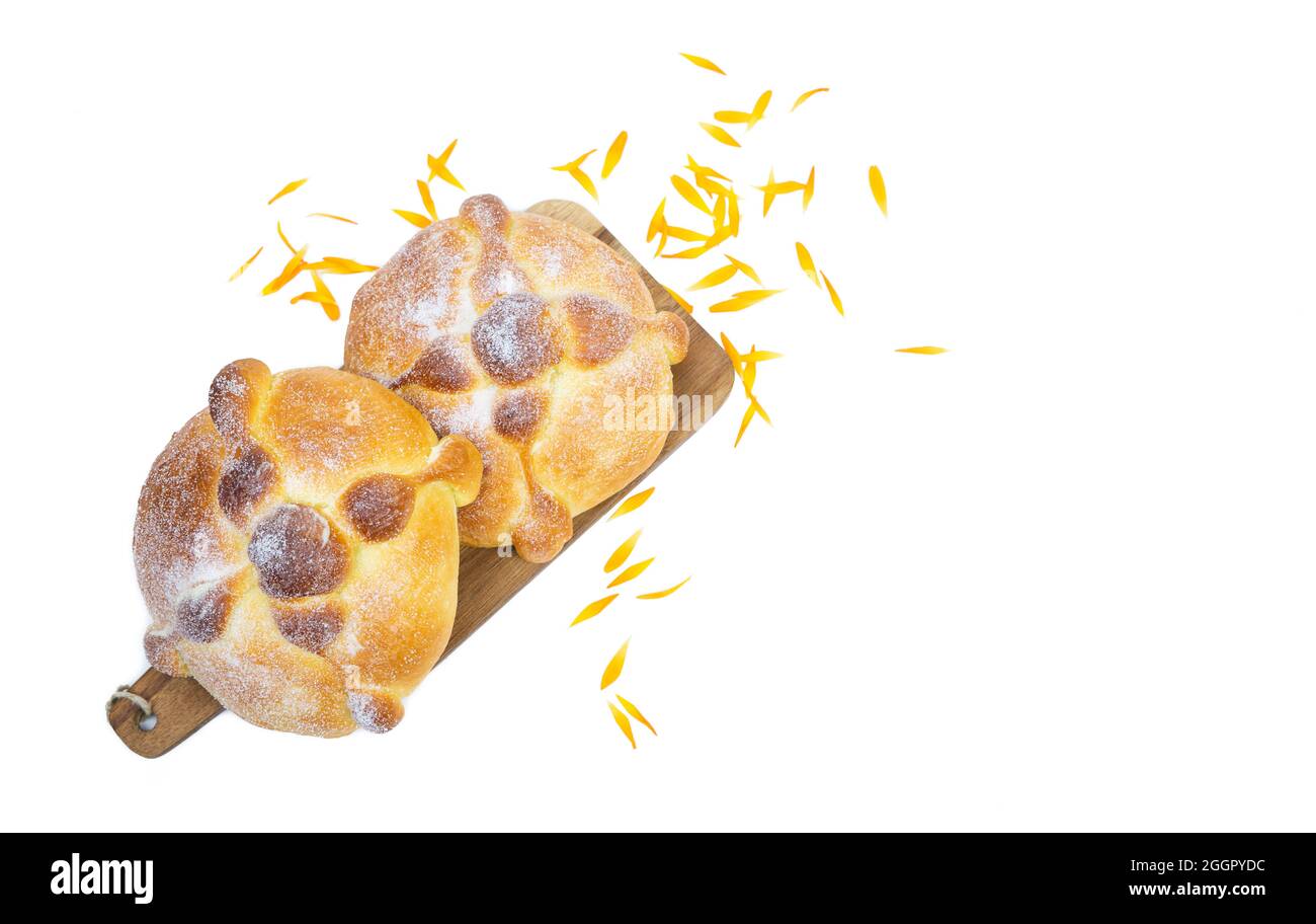 Dos de muerto on yellow background, typical mexican food. Day of the dead celebration. Copy space. Top view. Stock Photo