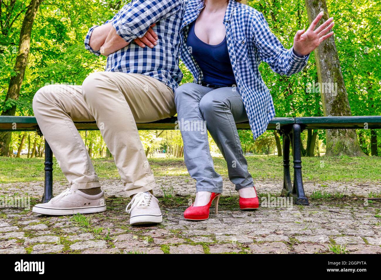 Man and woman sitting on the bench in beautiful summer park Stock Photo ...
