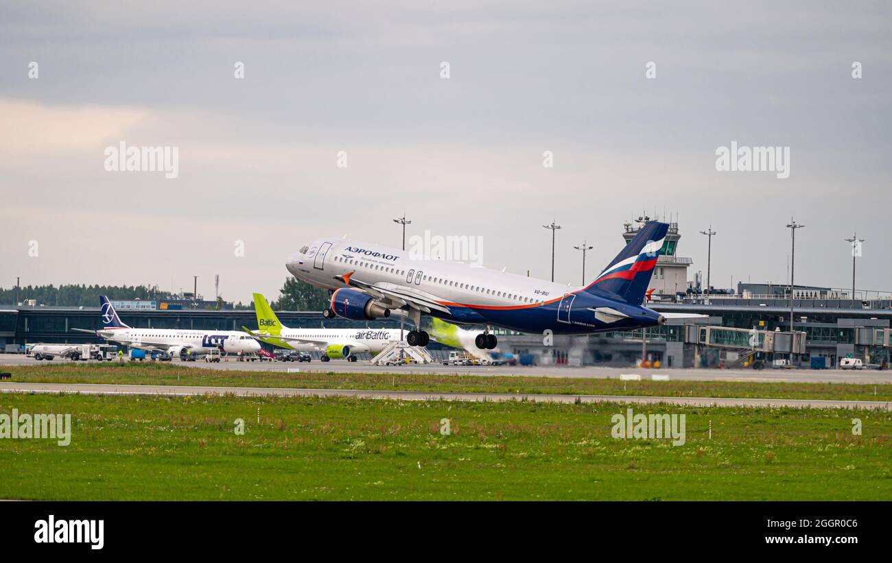 Riga, Latvia - August 31, 2021: Russian Airlines Airbus A320 VQ-BIU takes off from RIX International Airport on cloudy autumn day Stock Photo