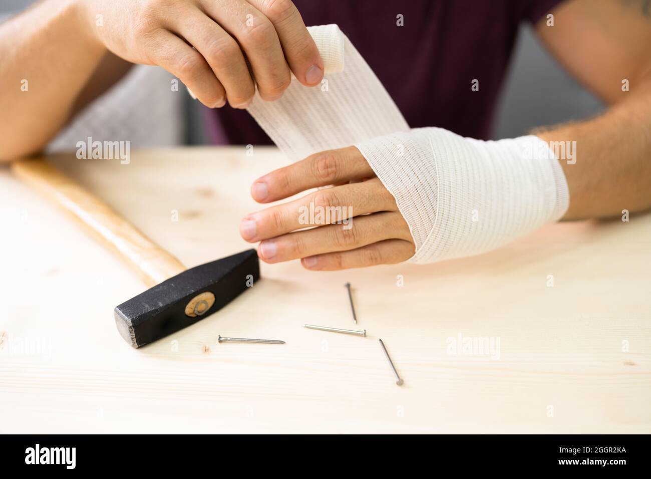 Hand And Finger Bandage After Hammer Accident. Hurt Finger Nail Stock