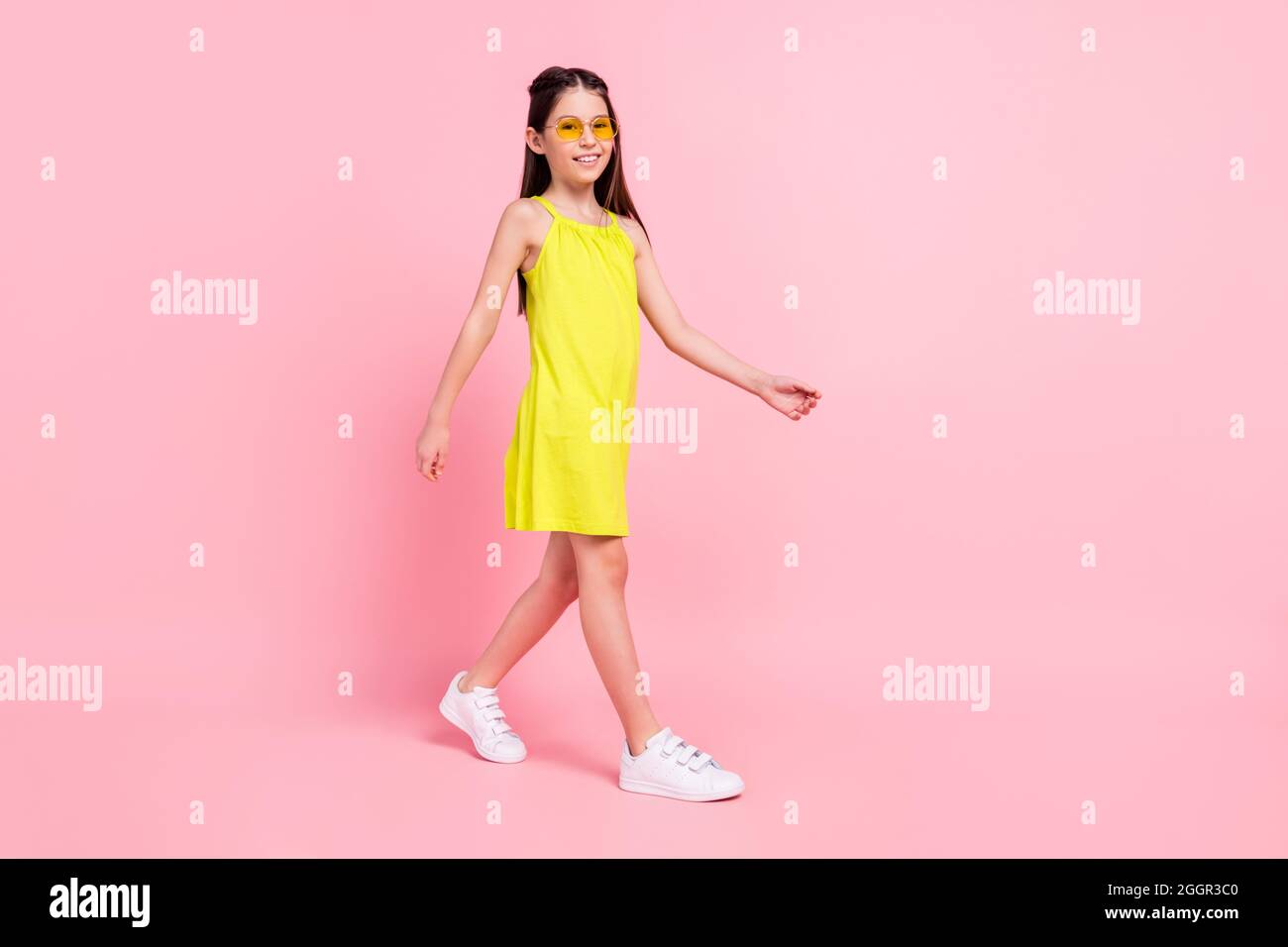 Full length photo of cute charming school girl wear yellow dress dark ...