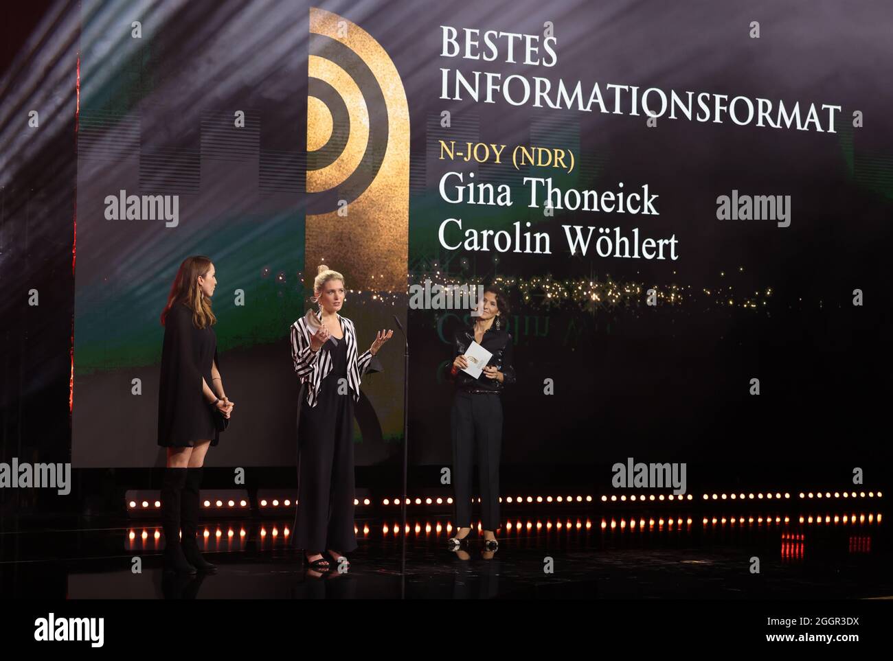 Hamburg, Germany. 02nd Sep, 2021. Antonia Rados (r) is on stage as laudator  during the German Radio Awards ceremony and presents the prize in the  category "Best Information Format" to Gina Thoneick