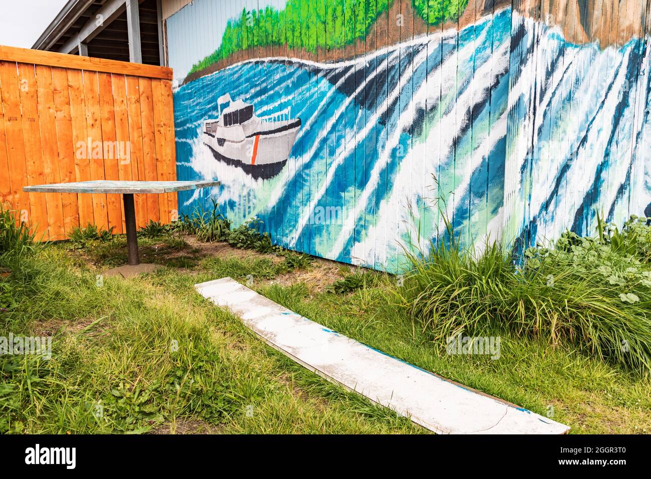 Coos Bay, Oregon, USA. May 2, 2021. Mural showing a Coast Guard surf rescue boat on the Oregon