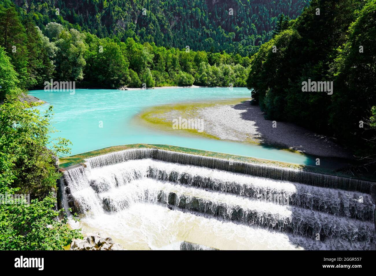 Lechfall near Füssen. Waterfall in Bavaria, Allgäu. River with turquoise blue water and surrounding landscape. Stock Photo