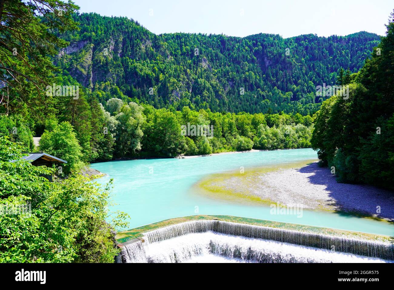 Lechfall near Füssen. Waterfall in Bavaria, Allgäu. River with turquoise blue water and surrounding landscape. Stock Photo