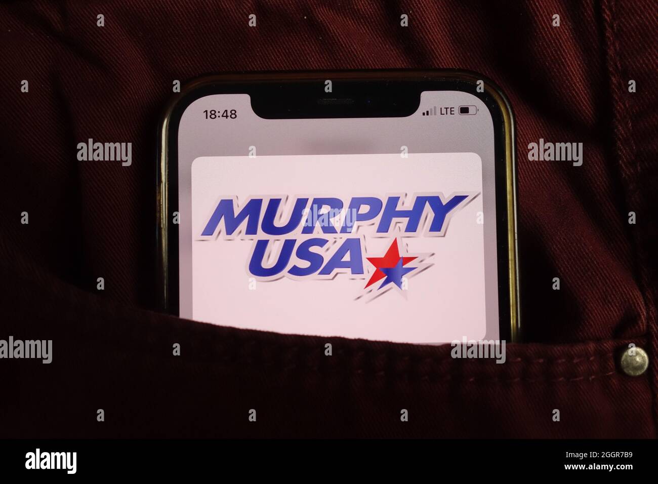KONSKIE, POLAND - August 17, 2021: Murphy USA corporation logo displayed on mobile phone hidden in jeans pocket Stock Photo