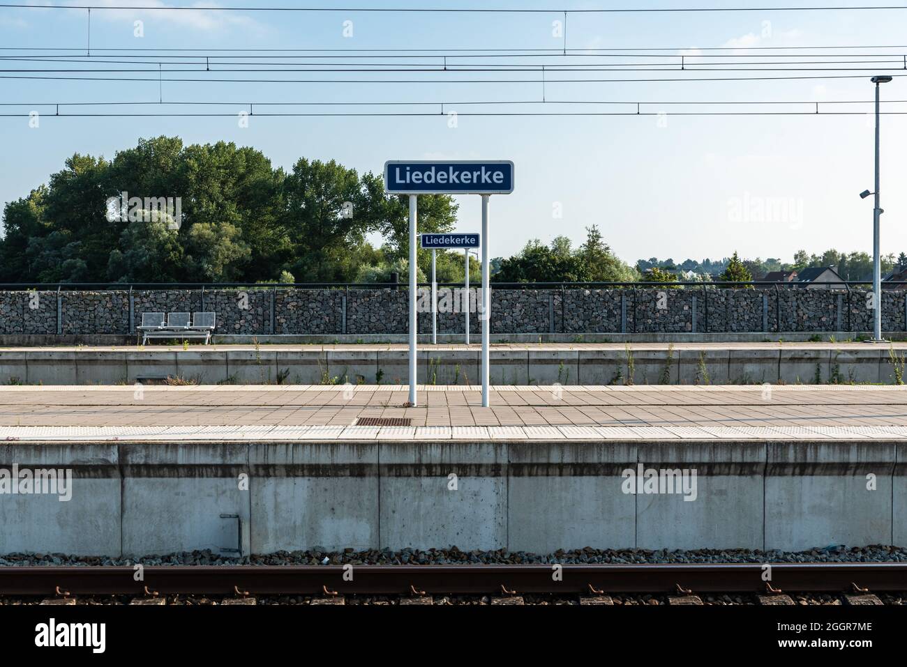 Railway, platform and tracks of the local Liedekerke trainstation Stock Photo